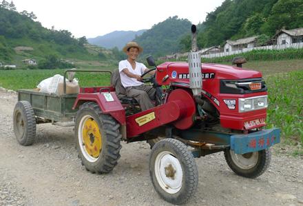 Man on a tractor DPRK